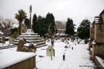 View of the southern graveyard and stone cross covered in snow