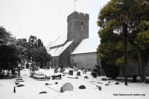 View of St Illtud's church with a snow covered graveyard